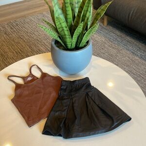Black synthetic leather college style mini skirt medium size and brown shirt 🍂